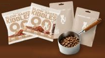 Two kibbles trial packs, two Catty Flossy trial packs and a steel scoop